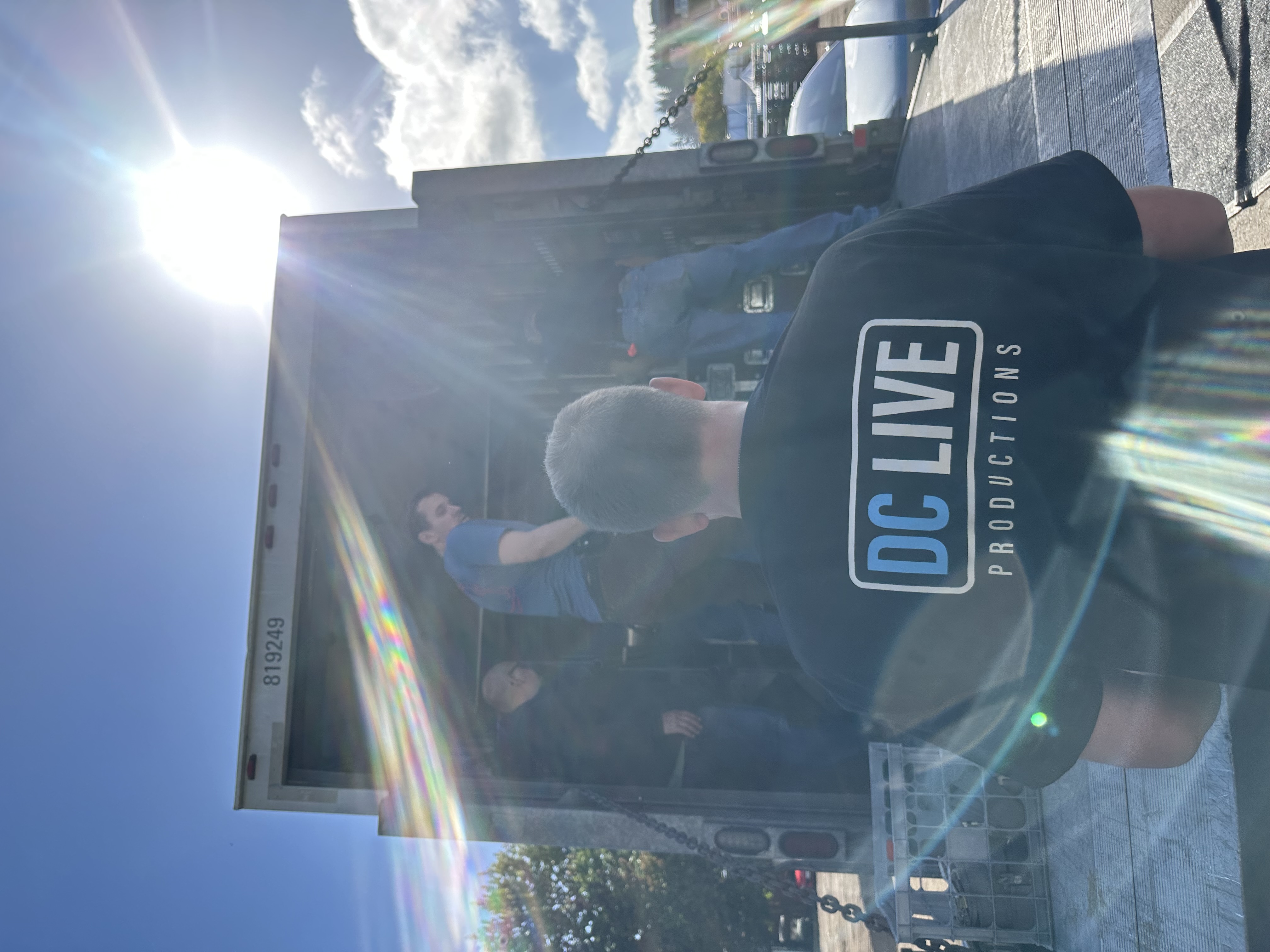 Meet The Team - Person With DCLive Shirt Photo